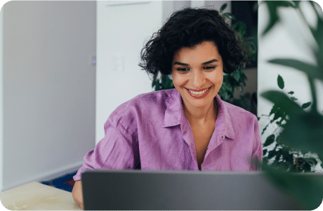Woman performing background checks on a candidate on her laptop