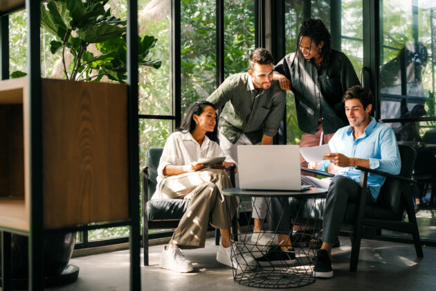 Team looking at a laptop