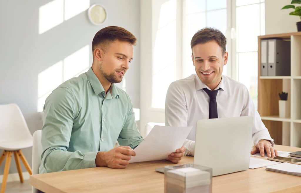 Two company employees choose practice management software together.